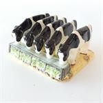 A toast rack in the shape of cows drinking from a trough.